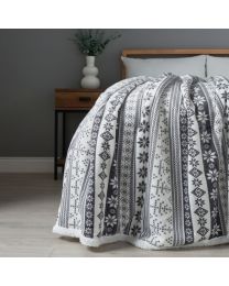 Christmas Fairisle Throw with Sherpa Back, Grey draped over bed