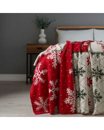 Christmas Patchwork Throw, Red draped over foot of bed