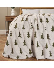 Christmas Trees Faux Fur Throw, Cream and Green on edge of bed