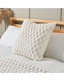 Honeycomb Faux Fur Cushion, Cream on bed