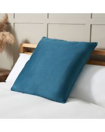 Large Velour Piped Cushion, Teal on bed